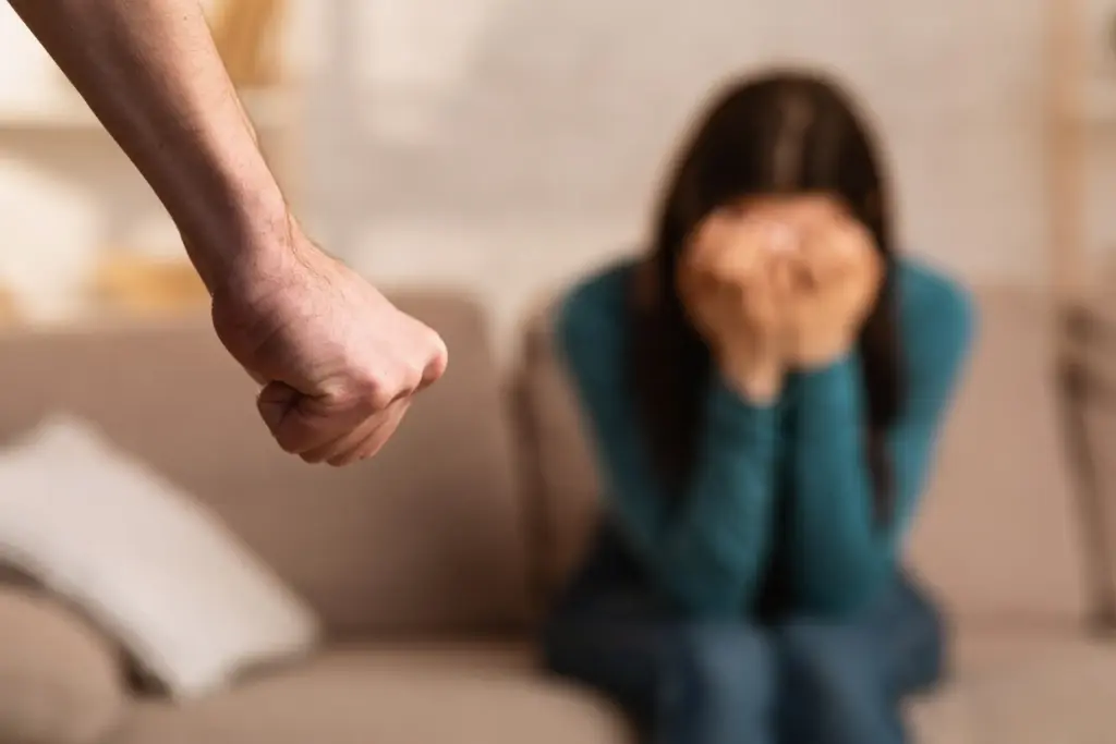 A man threatening a woman with violence. 