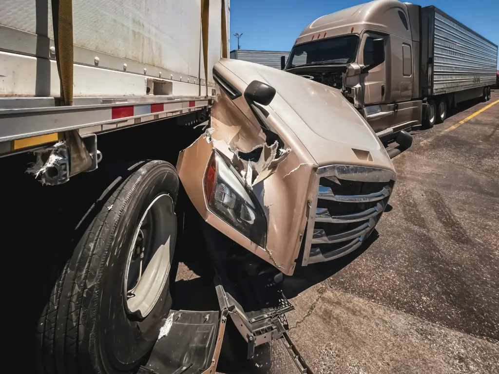 A truck crash where it lost the hood of the truck.