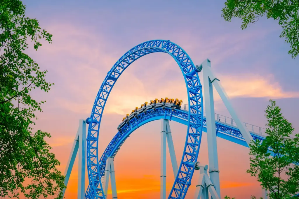 A shot of a rollercoaster while the sun is setting. 
