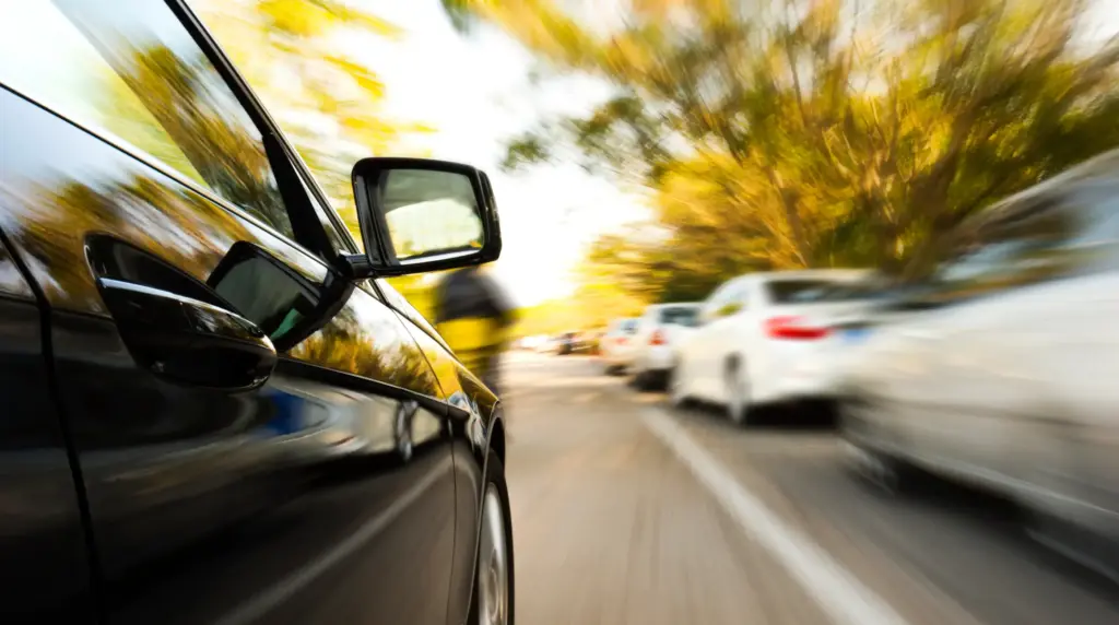 A car speeding down a residential area.
